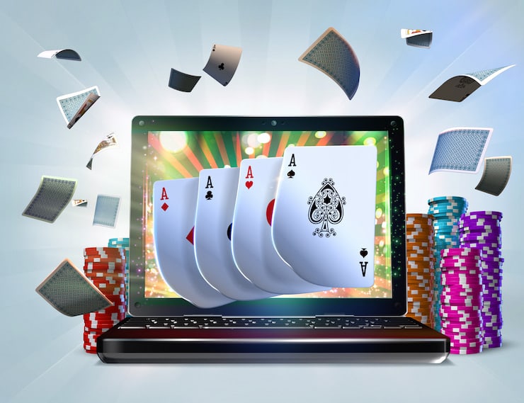 laptop with screen of cards and poker chips at the side