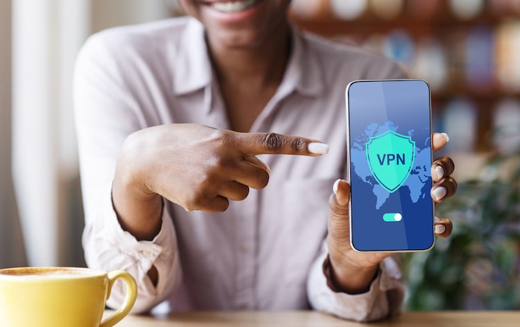 woman pointing to phone with VPN