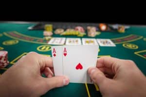 male poker player holding two cards aces 639032 947